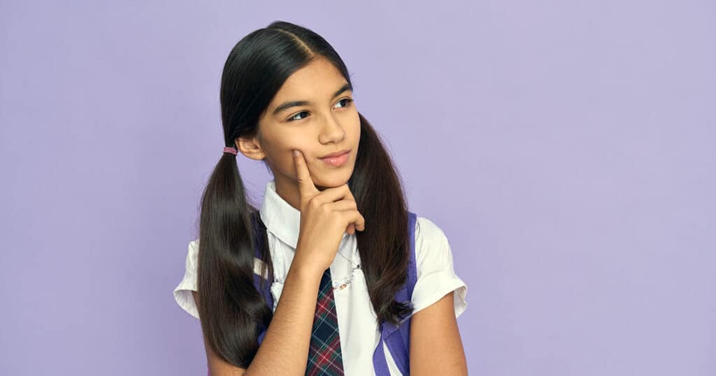 Schoolgirl engrossed in thought